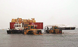 Goods coming ashore in Iqaluit in 2009. Photograph Courtesy of Luc Beland Canadian Coast Guard
